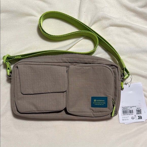 lululemon athletica Handbags - lululemon athletica Tan and Green multi pocket, Crossbody. NWT